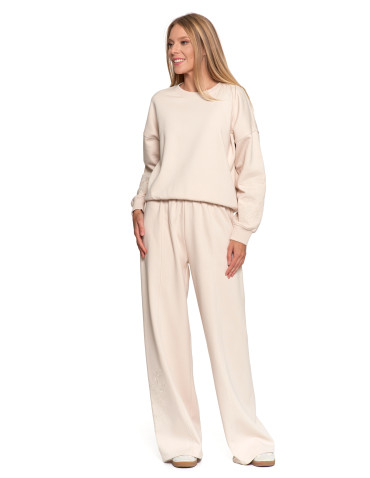 Spodnie - Damskie spodnie dresowe ocieplane z szeroką nogawką i haftem KREMOWY - produkt 3