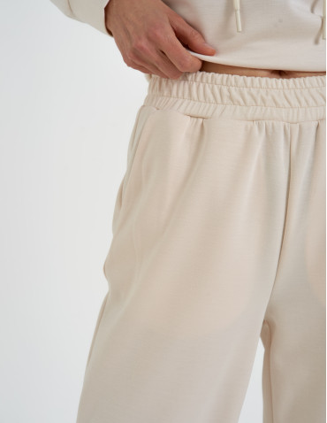 Spodnie dresowe - Spodnie dresowe damskie szerokie z kieszeniami KREMOWY - produkt 5