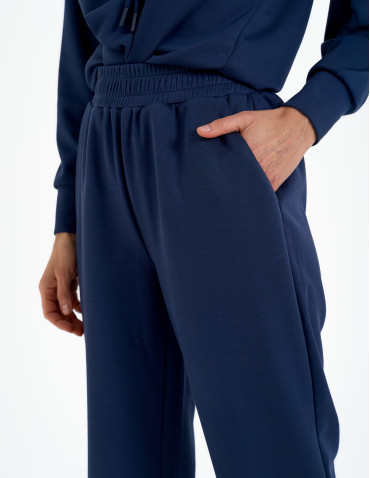 Spodnie dresowe - Spodnie dresowe damskie szerokie z kieszeniami NIEBIESKI - produkt 4