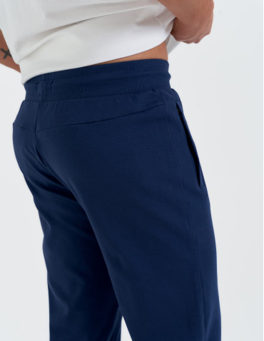 Spodnie dresowe - Męskie spodnie dresowe z prostą nogawką GRANATOWY - produkt 5