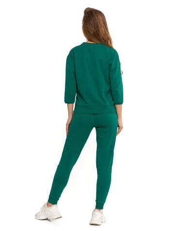 Bluzy damskie - Bluza dresowa damska z rękawem 3/4 i rozcięciem po bokach ZIELONY - produkt 9